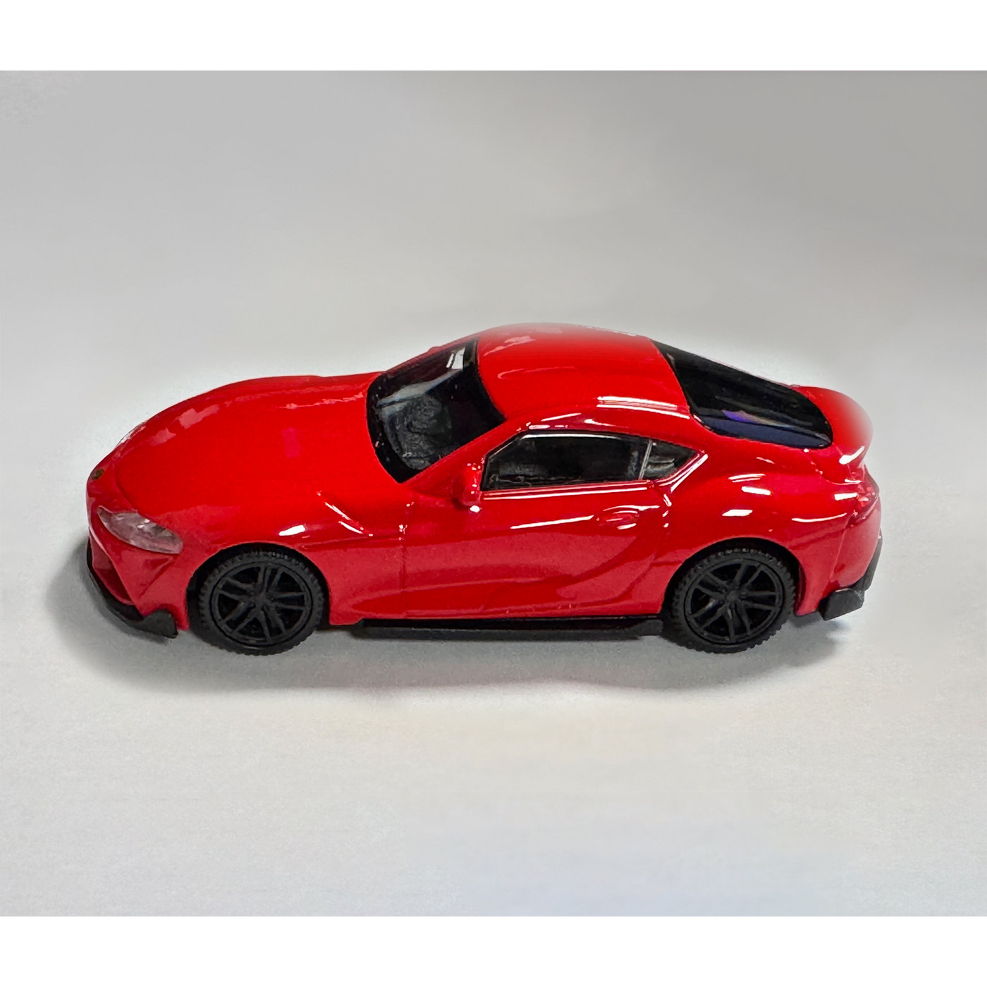 Model Toyota Supra (měřítko 1:43, cca 10x4x3 cm, červená)