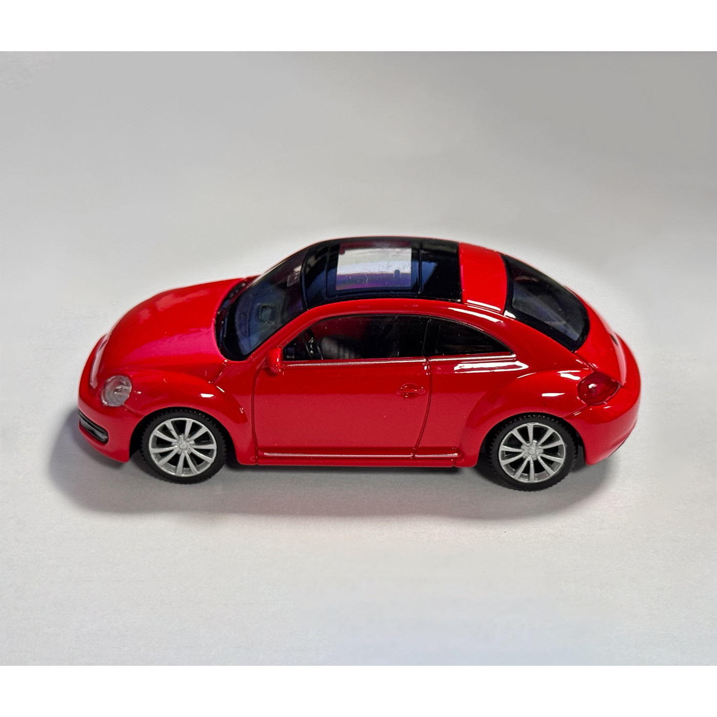 Scale model VW the Beetle (scale 1:43, about 10x4x3 cm, red)